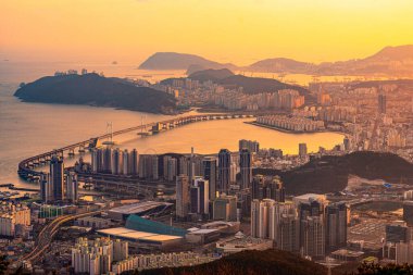 Skyline of Busan, South Korea from above at dusk.