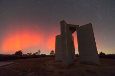 A rare Aurora Borealis behind the Georgia Guidestones in Elberton, Georgia, USA.