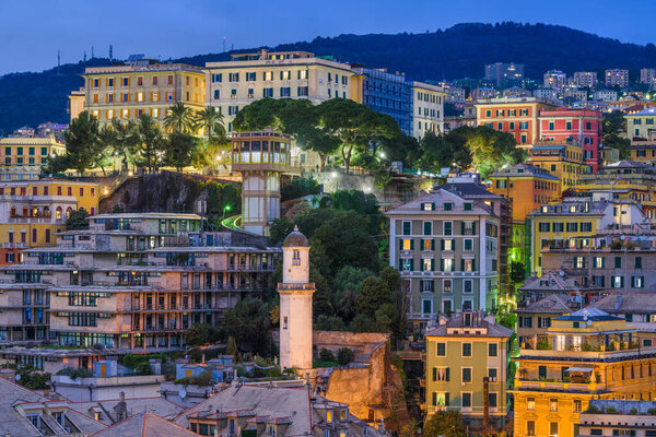 Genova, Italy city skyline view towards the historic belvedere castelletto at twilight.