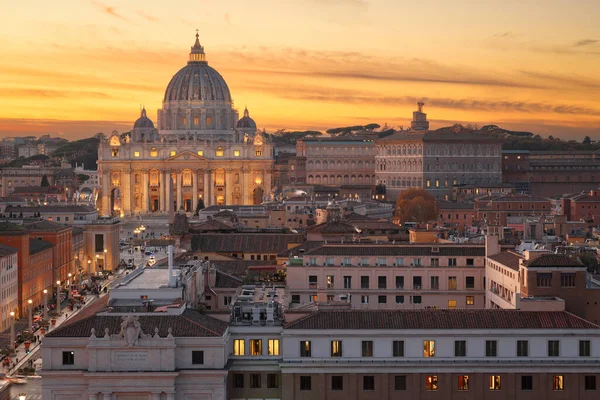 Vatican City skyline with St. Peter's Basilica during sunset.