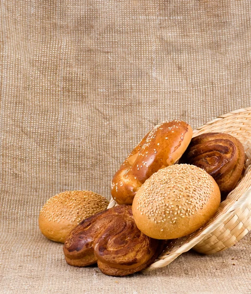 Panary rolls pour out from a basket — Stock Photo, Image