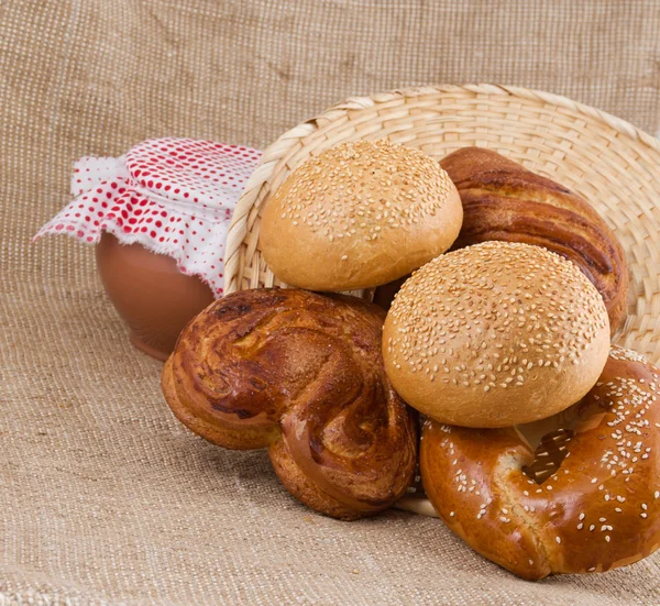 Panary rolls pour out from a basket — Stock Photo, Image