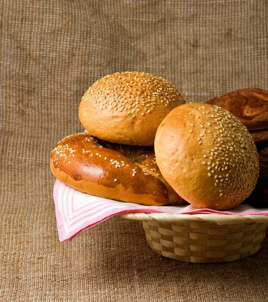 Panary rolls lie on a napkin in a basket — Stock Photo, Image