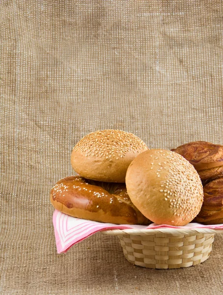 Panary rolls lie on a napkin in a basket — Stock Photo, Image