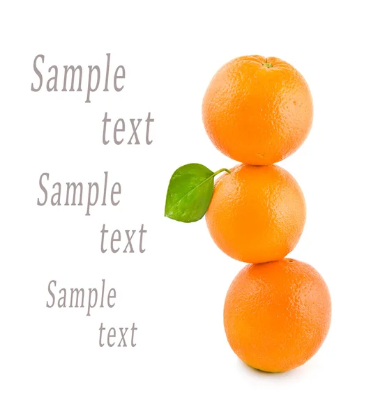 Three oranges stand on each other on a white background — Stock Photo, Image