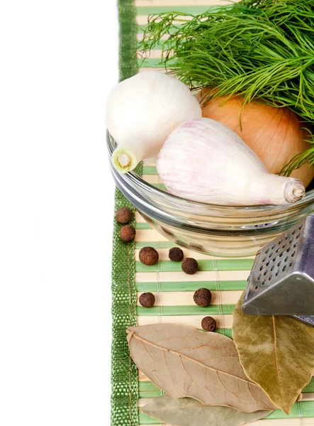 Onion and garlic lie in a dish with a dill on a napkin — Stock Photo, Image