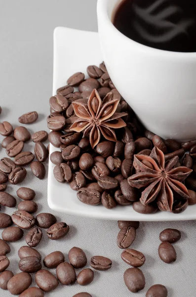 Coffee, grains, anise on a grey background — Stock Photo, Image