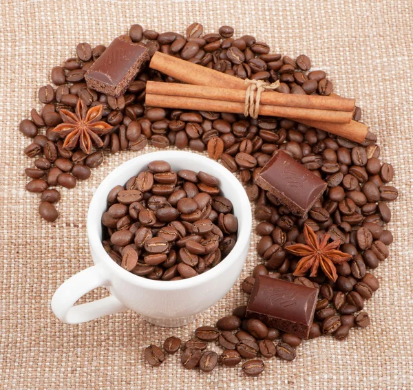 Background from coffee of bobs, chocolate, cinnamon and anise on — Stock Photo, Image