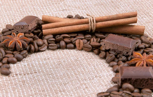 Background from coffee of bobs, chocolate, cinnamon and anise — Stock Photo, Image