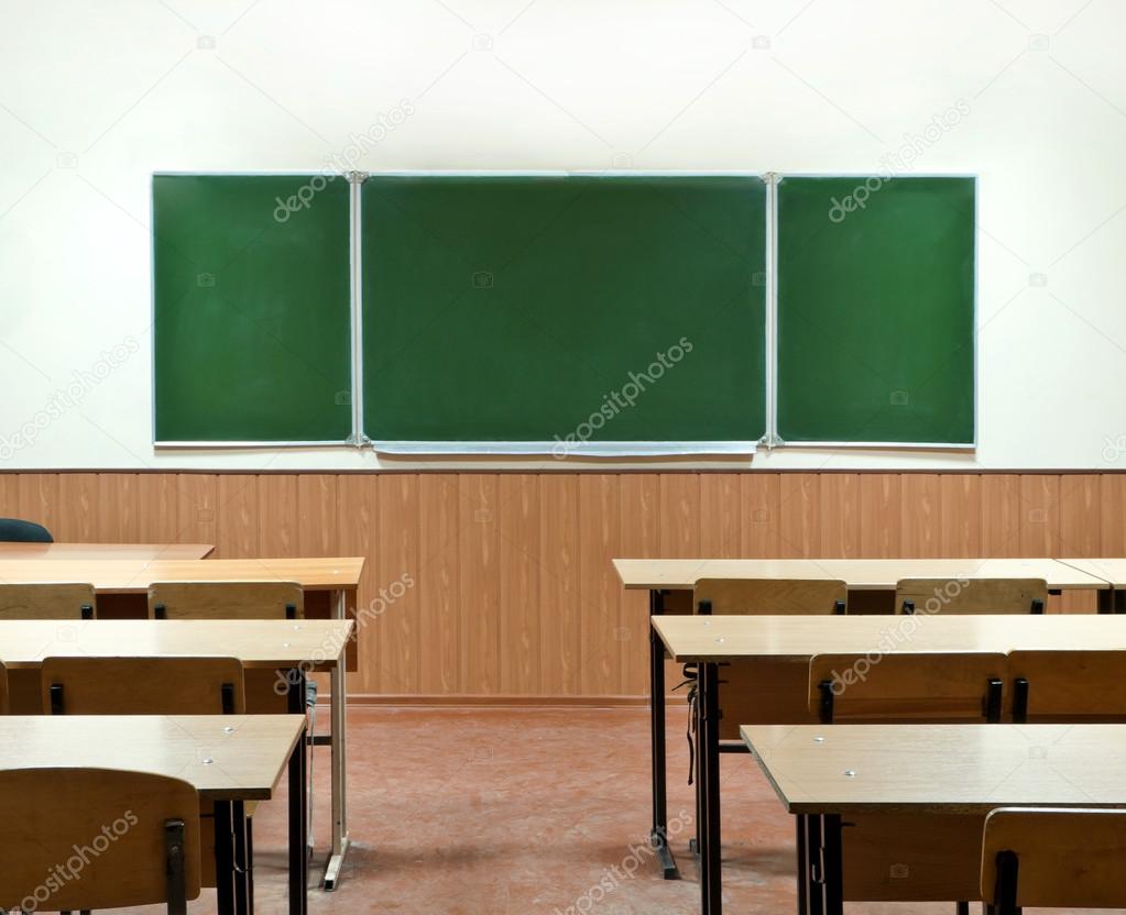 class room with a school board and school desks