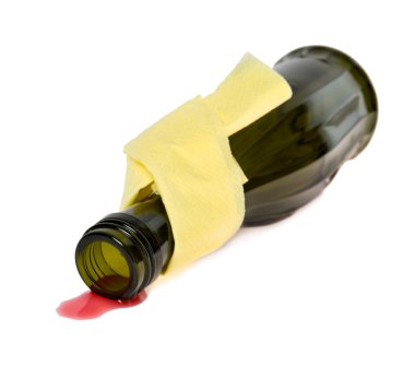 Spilled wine from a bottle on a white background clipart