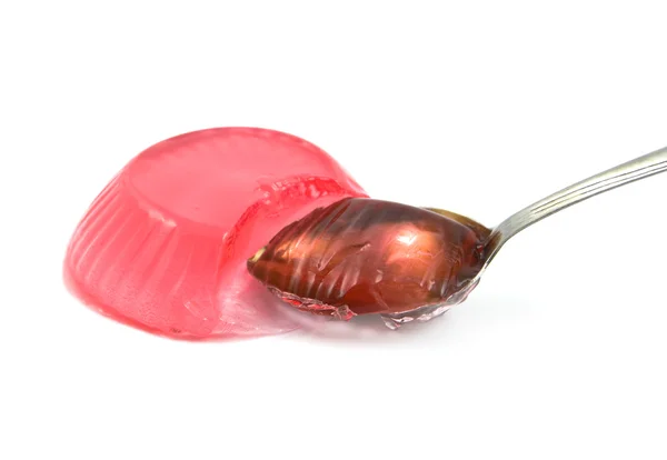 Jelly with a spoon on a white background — Stock Photo, Image