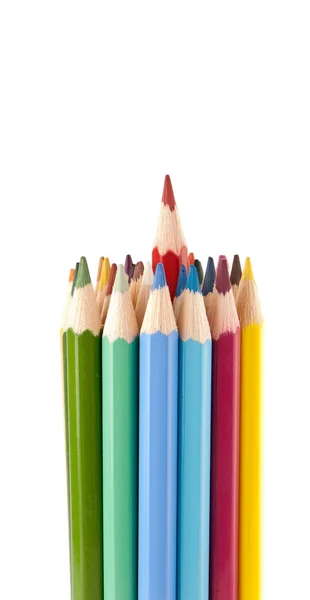 Red pencil will be pulled out from a set of crayons — Stock Photo, Image