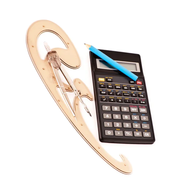 Pencil on a calculator, compasses and French curve on white — Stock Photo, Image