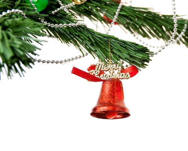 Christmas bell and new year beads on the branch of a tree — Stock Photo, Image