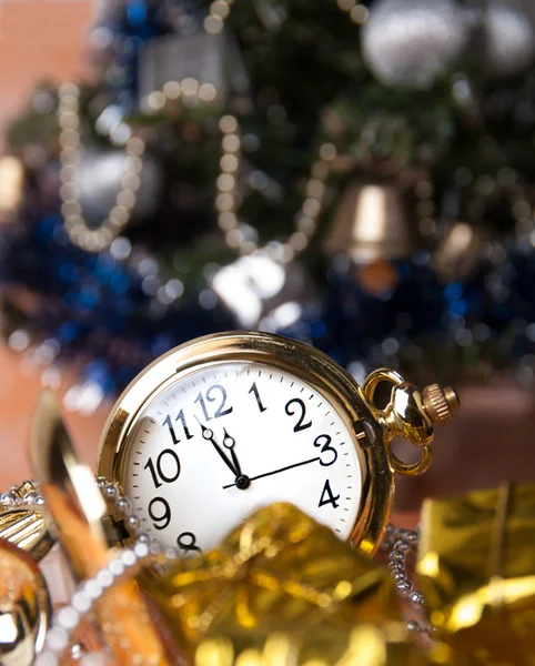 Round pocket watches lie among the gifts — Stock Photo, Image