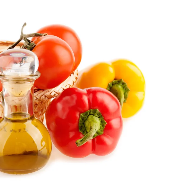 Pepper and a bottle with olive oil on the background — Stock Photo, Image
