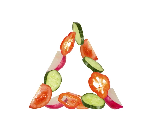 Triângulo de verduras em um fundo branco — Fotografia de Stock