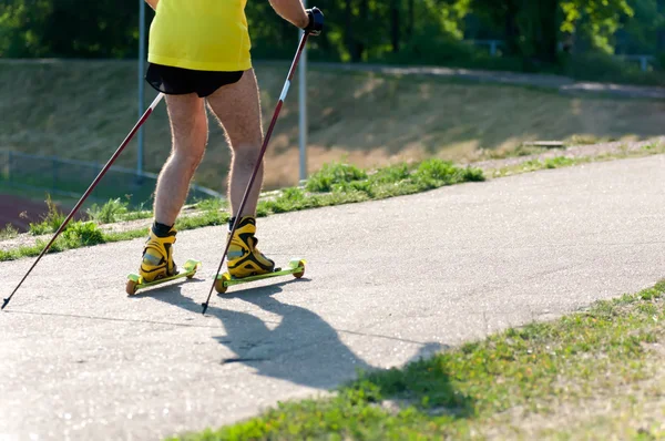 Man is exercising on roller skis — Stock Photo, Image