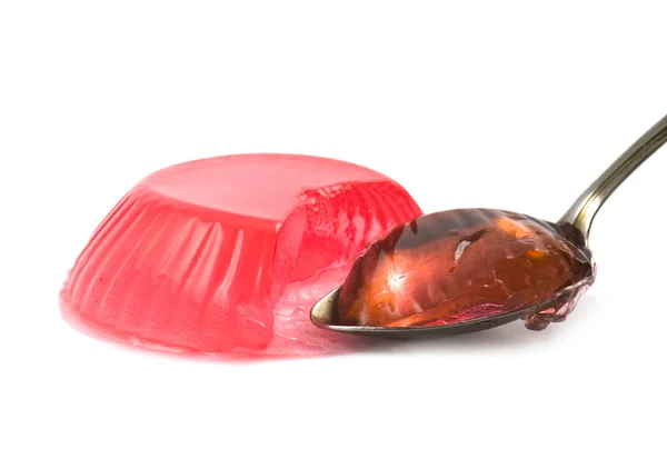 Jelly with a spoon on a white — Stock Photo, Image
