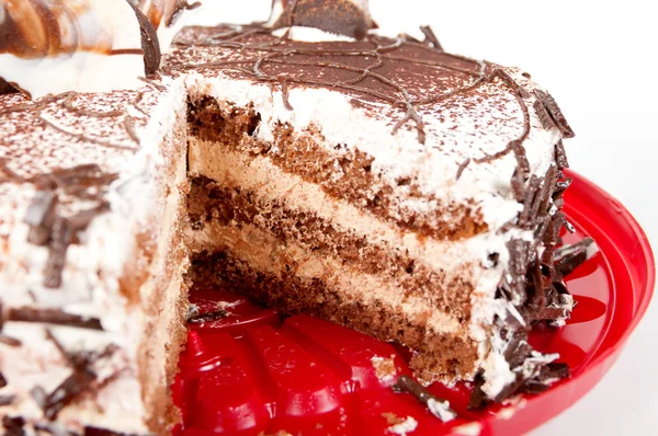 Chocolate cake on red plate — Stock Photo, Image