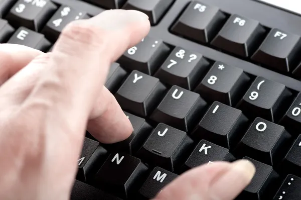 Finger women clicks the numbers on the keyboard macro — Stock Photo, Image