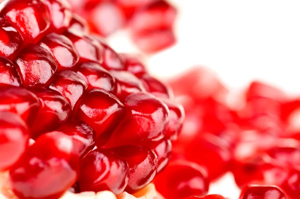 Fruit pomegranate broken down into two parts with the grain — Stock Photo, Image