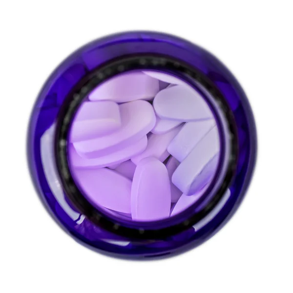 White tablet in the blue jar top view in isolation — Stock Photo, Image