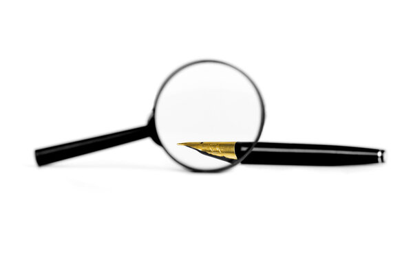 Magnifying glass and  pen