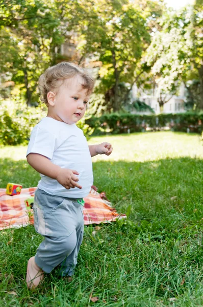 Small child is on the grass — Stock Photo, Image