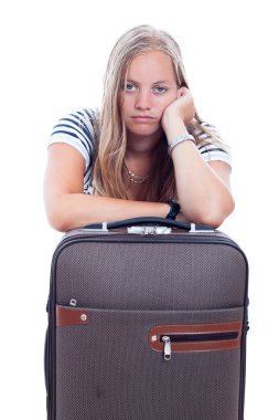 Bored young woman traveling with luggage clipart