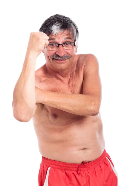 Grappige senior mens gebaren vuist — Stockfoto