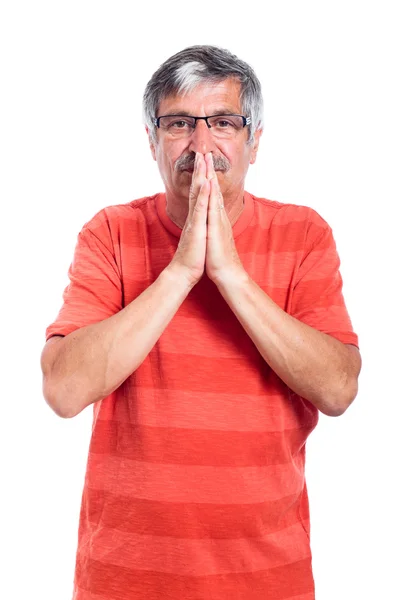 Pensive senior man praying — Stock Photo, Image