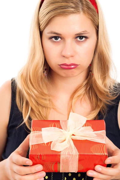 Disappointed woman with gift — Stock Photo, Image