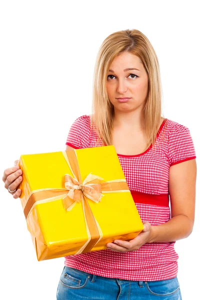 Disappointed woman with gift — Stock Photo, Image