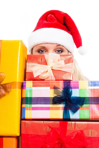 Woman in Santa hat and Christmas gifts — Stock Photo, Image