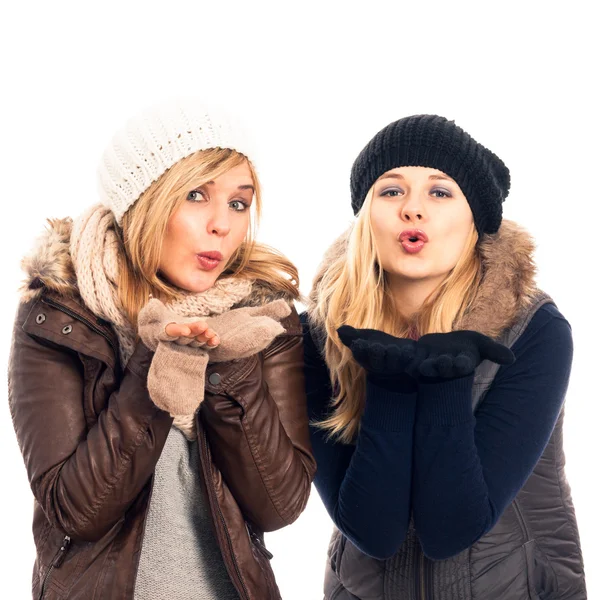 Happy women in winter clothes sending kiss — Stock Photo, Image