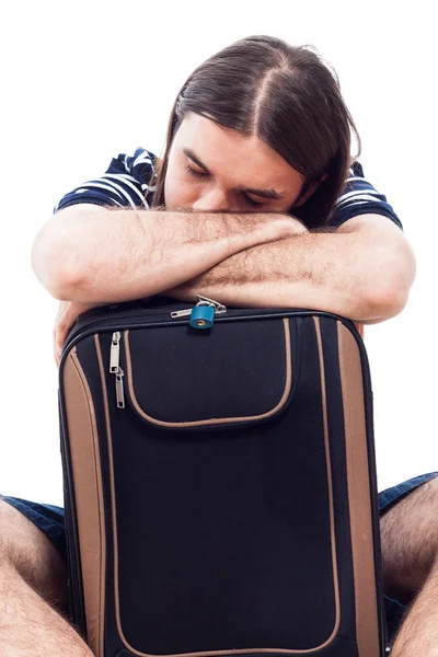 Viajero cansado turista durmiendo en el equipaje —  Fotos de Stock