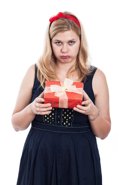 Disappointed woman with small present — Stock Photo, Image