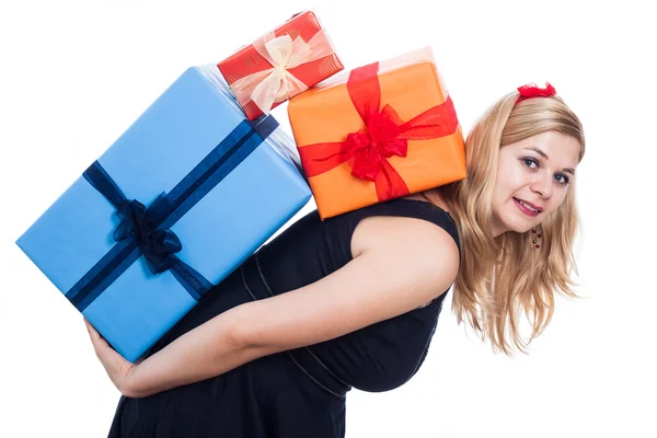 Happy woman carrying presents — Stock Photo, Image
