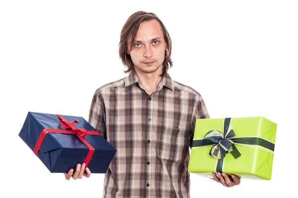 Serious man with two gifts Royalty Free Stock Photos