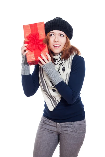 Curious winter woman with present — Stock Photo, Image
