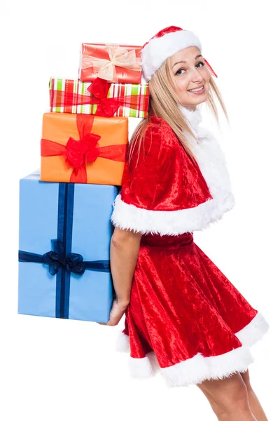 Weihnachtsfrau trägt viele Geschenke bei sich — Stockfoto