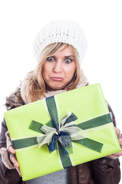 Disappointed woman with present — Stock Photo, Image