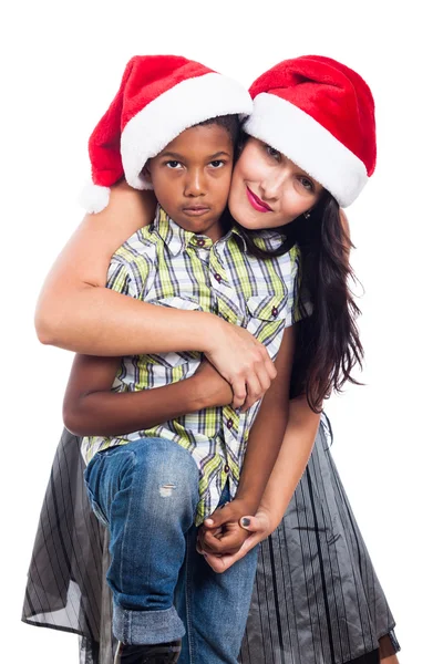 Weihnachtsfamilie mit Weihnachtsmütze — Stockfoto