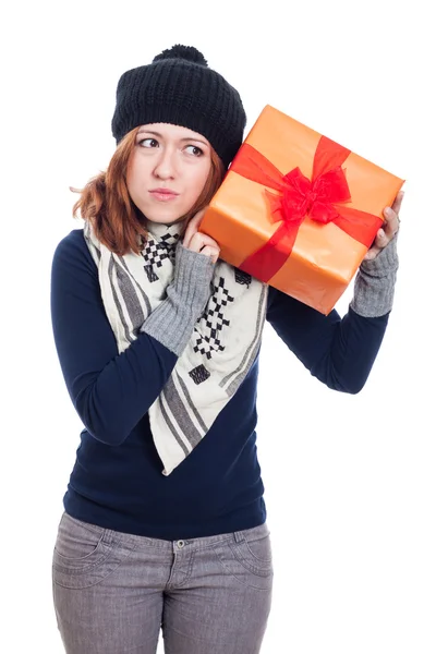 Curious woman with present — Stock Photo, Image