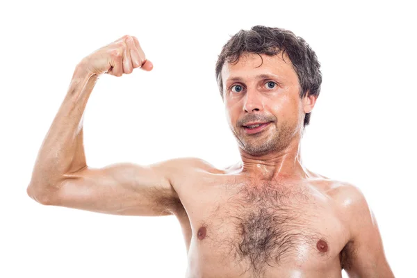 Magro homem mostrando bíceps — Fotografia de Stock