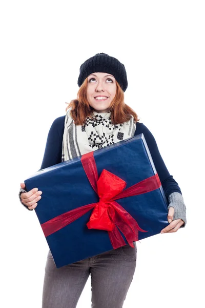 Satisfied woman with big gift looking up — Stock Photo, Image