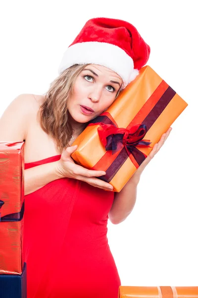 Curious Christmas woman with present — Stock Photo, Image