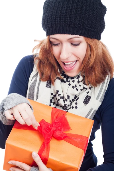 Exited woman opening present — Stock Photo, Image